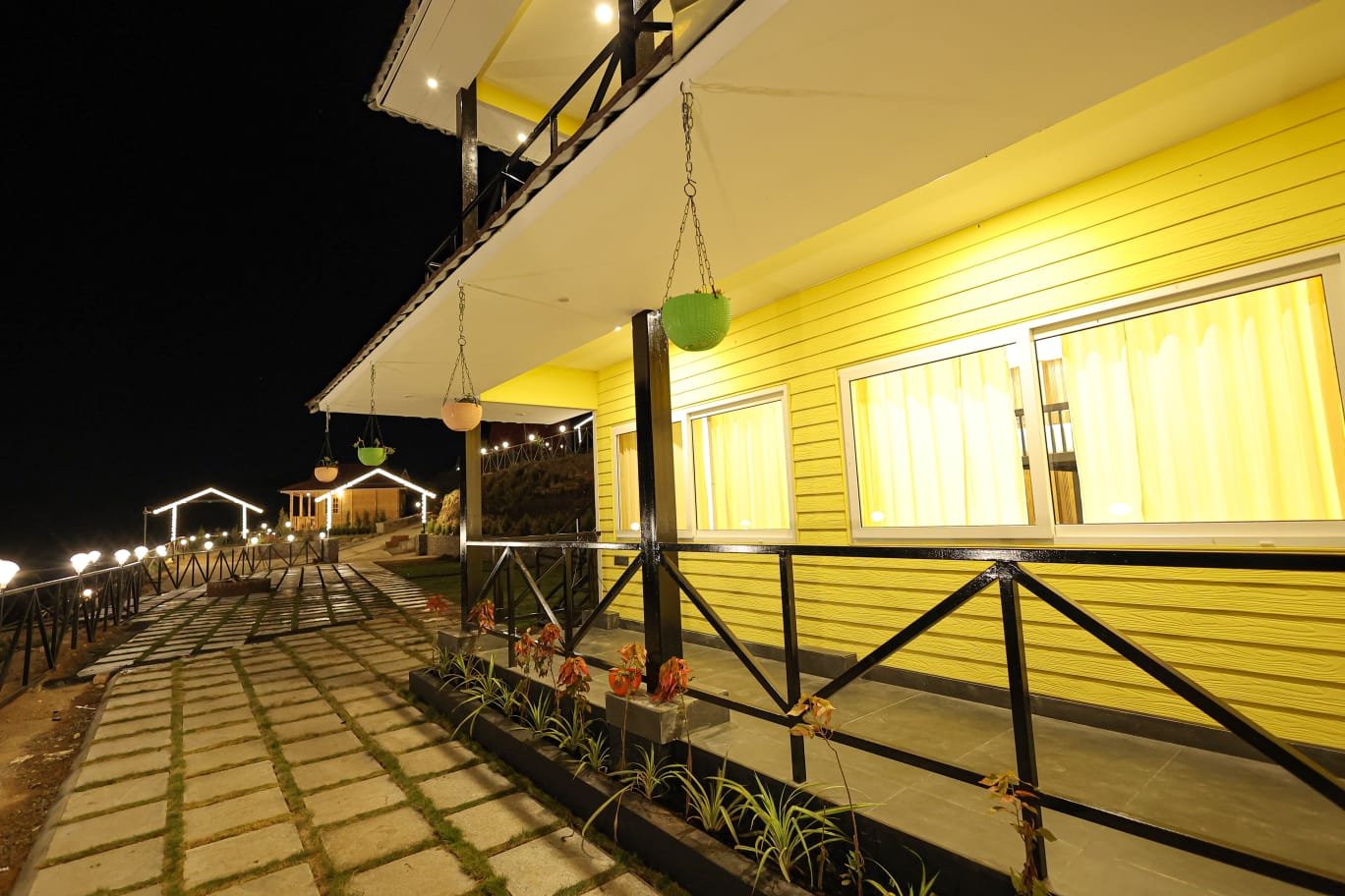 Veranda and walkway at night at Misty Meadows