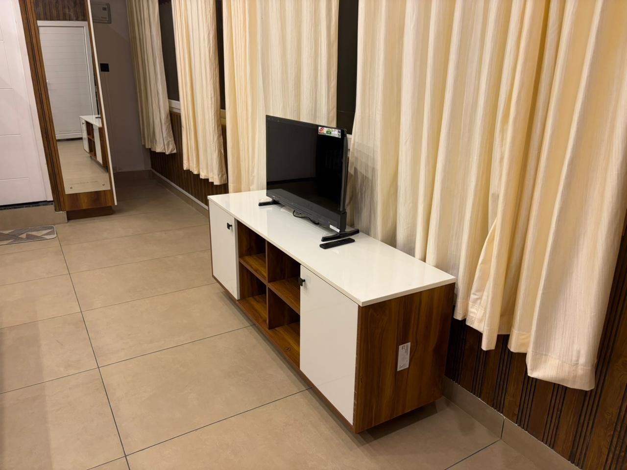 TV unit and curtains at Misty Meadows